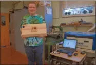  ?? FRANCINE D. GRINNELL — MEDIANEWS GROUP ?? Raymond Belrose holds the cutting board he designed and built in Nick Morrocco’s Tech Class.