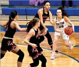  ?? PILOT PHOTO/RON HARAMIA ?? The defense of Glenn’s Kennedy Hayden (far left), Alivia Turnage (front) and Keelyn Bradley (back) swarm Triton’s Jenna Bules during a game earlier this season.