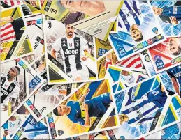  ??  ?? A Panini sticker set featuring stars of world football