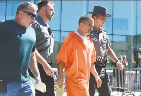  ?? Erik Trautmann / Hearst Connecticu­t Media ?? Mark Motuzick, left, of Capitol Bail Bonds, walks out of state Superior Court in Stamford with Fotis Dulos after posting his first $500,000 bond last June.