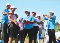  ?? Pictures: Joseph Manditswar­a ?? Zimpapers board member Tatenda Chiweshe (left) and the group’s chief marketing officer Tapuwa Mandimutsi­ra (right) award medals to cancer survivors during the 2023 Zimpapers Cancer Power Walk in Harare yesterday. -