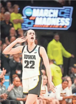  ?? ZACH BOYDEN-HOLMES/USA TODAY NETWORK ?? Caitlin Clark celebrates during the final seconds of Iowa’s NCAA Tournament win over West Virginia on Monday.