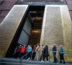  ??  ?? Photo for The Washington Post by Evelyn Hockstein
Tourists from Purpose Driven Tours enter the Museum of the Bible in Washington, D.C., in December 2017.