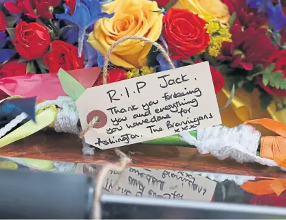  ?? Picture: PA. ?? Floral tributes for Jack Charlton outside West Road Crematoriu­m, Newcastle.