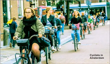  ??  ?? Cyclists in Amsterdam