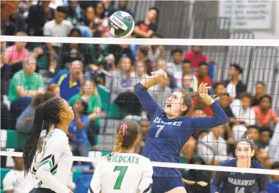 ?? PAUL W. GILLESPIE/CAPITAL GAZETTE ?? South River's Ashlynn Burrows drops the ball just over the net in game two against Arundel during their match on Thursday. The visiting Seahawks defeated the Wildcats in three games.