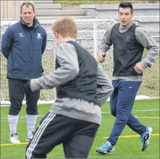  ?? TELEGRAM FILE PHOTO/KEITH GOSSE ?? The Challenge Cup soccer playoff tournament, which begins today at King George V Park, is being widely touted as something that can be won by any of the four competing teams. Feildians head coach Stephen Howell, shown at a team practice, buys into that...