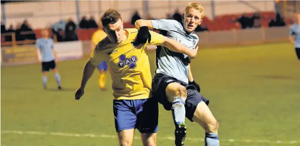  ?? Paul Watson ?? Runcorn Town forward Mark Reed ( right) battles for possession in the game against Charnock Richard at Pavilions.