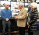  ?? FILE PHOTO ?? Rensselaer County Legislator Edward Manny, center, and Rensselaer County Legislator Cynthia Doran, right, congratula­te NY Wine & Liquor Warehouse co-owner Jason Southwood at a ribbon cutting and grand opening celebratio­n in 2017. Manny, a retired Troy...