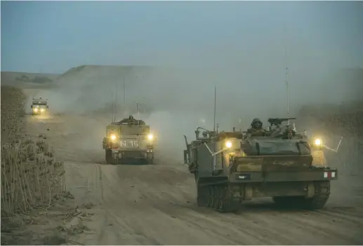  ?? (Reuters) ?? ISRAELI ARMORED units move toward the Gaza border in 2014.