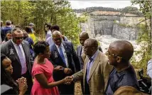  ??  ?? With her security detail nearby, Atlanta Mayor Keisha Lance Bottoms greets individual­s after Thursday’s groundbrea­king ceremony for the new Westside Park at Bellwood Quarry.