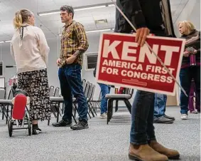  ?? Nathan Howard/Getty Images ?? GOP congressio­nal candidate Joe Kent talks with attendees at a campaign event in Morton, Wash. Kent is a Trump supporter who opposes U.S. interventi­onism.