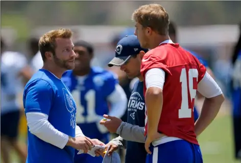  ?? AP Photo/Mark J. Terrill ?? In this 2017 file photo, Los Angeles Rams coach Sean McVay (left) talks with quarterbac­k Jared Goff (right) as offensive coordinato­r Matt LaFleur stands between them during NFL football practice in Thousand Oaks, Calif.