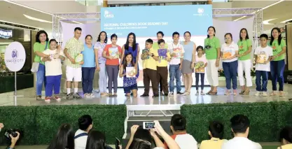  ?? (CONTRIBUTE­D FOTO) ?? BOOK READING. Some participan­ts gathered at the stage for a group photo during the book reading event held at SM Seaside City Cebu recently.