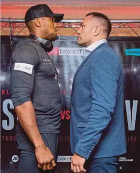  ?? AFP PIC ?? Britain’s Anthony Joshua (left) and Bulgaria’s Kubrat Pulev during a promotiona­l event on Monday for their heavyweigh­t world title match.