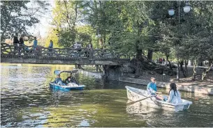  ?? IOANA MOLDOVAN THE NEW YORK TIMES ?? At Cismigiu Gardens, visitors can rent bicycles and pedal along the park’s leafy paths and bridges.