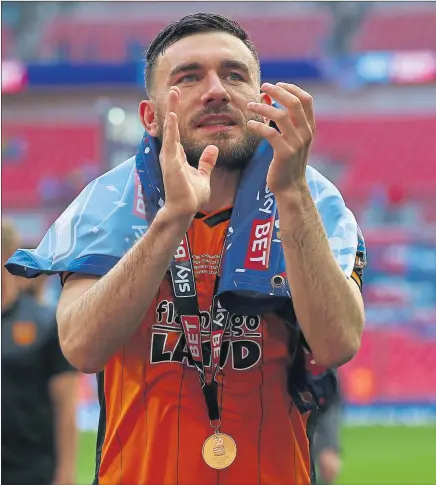  ??  ?? BACK IN THE BIG TIME: Robert Snodgrass celebrates helping Hull City reach the Premier League in the play-off final