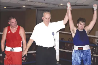  ??  ?? Truro boxer Logan Paul, in red, mounted a stout defence against his opponent Josh Rhodenizer during Beyond Boxing's first- ever fight card at the Best Western Glengarry Friday, however, Rhodenizer went on to win.