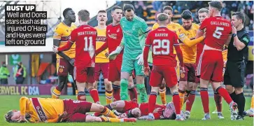  ?? ?? BUST UP
Well and Dons stars clash as
injured O’Hara and Hayes were left on ground