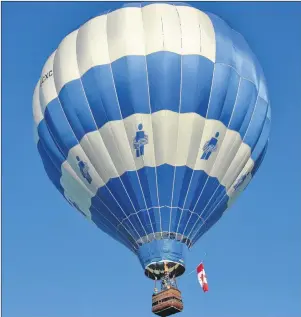  ?? RYAN ROSS/THE GUARDIAN ?? It seems like the sky is the limit as the P.E.I. Balloon Adventures hot-air balloon floats into the air near Hunter River Thursday with its passengers and a pilot onboard. Theresa Kelly lived out a lifelong dream of riding in a hot-air balloon thanks...