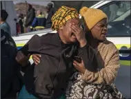  ?? (AP/Shiraaz Mohamed) ?? A woman weeps Sunday at the scene of an overnight bar shooting in Soweto, South Africa.