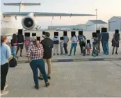  ?? COURTESY ?? Migrants in San Antonio are loaded onto a plane on Sept. 14 to fly to Martha’s Vineyard. This photo was part of a public records release on Oct. 14.