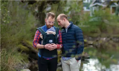  ?? Photograph: Amanda Lucier/The Guardian ?? James, left, and Rob pose for a portrait with their baby son in Portland, Oregon.