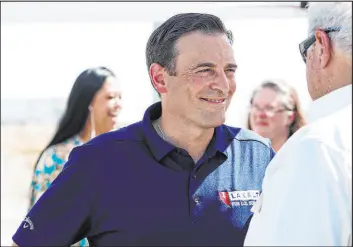  ?? Rachel Aston Las Vegas Review-journal @rookie__rae ?? U.S. Senate candidate Adam Laxalt greets supporters prior to a panel discussing energy policy outside Rebel Oil’s terminal in Las Vegas on Sept. 7.