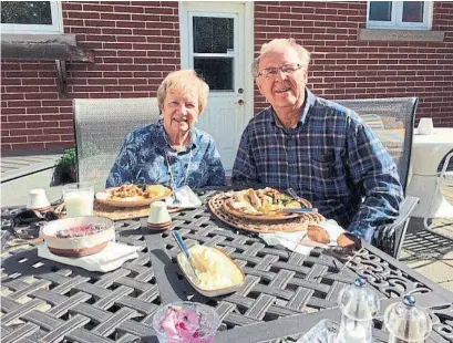  ?? COURTESY TANYA MCKAY ?? Tanya McKay and her husband, Nelson, at a physically distanced Thanksgivi­ng dinner. While Tanya admits they are luckier than many others, “much of the fun has gone from our lives” due to the coronaviru­s pandemic.