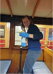  ?? MATTHEW WEAR ?? Making sure carriages are clean and presentabl­e for passengers is an important task, more so during the coronaviru­s pandemic. Young volunteer Esther cleans the interior of a Talyllyn Railway carriage at Tywyn on August 15, 2019.