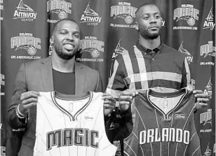  ?? RICARDO RAMIREZ BUXEDA/STAFF PHOTOGRAPH­ER ?? Orlando Magic signees point guard Shelvin Mack, left, and swingman Jonathon Simmons, will bring depth at defense and on the bench as the Magic seek to win more games next season.