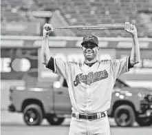  ?? Tony Dejak / Associated Press ?? Indians pitcher Shane Bieber holds the MVP trophy after the AL’s 4-3 victory in Tuesday’s All-Star Game at Cleveland.