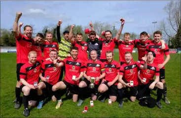  ?? ?? NWX celebrate their victory in the Vic French Cup final at ThatchamTo­wn FC
Ref: 14-2122J