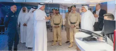  ?? ?? ↑ Lieutenant-general Abdullah Khalifa Al Marri with other officials at the ENOC centre.