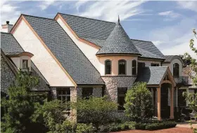  ?? Photo courtesy of Ecostar ?? Attractive recycled plastic roofing materials can be made into many styles. Notice the roof ridge vent for efficiency.