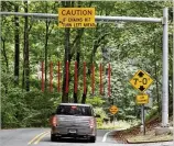  ??  ?? Two sections of rubberized pipes, which are built to “get ran over by cars,” will be installed over the length of the chains. This will allow vehicles to hit the lower pipe without affecting the top one.