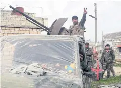  ??  ?? SIGNALLING VICTORY: Syrian army soldiers in southern Idlib pose for a picture earlier this week.