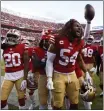  ?? NHAT V. MEYER – BANG ?? San Francisco 49ers’ Fred Warner (54) celebrates an intercepti­on against the Miami Dolphins during a game in December.