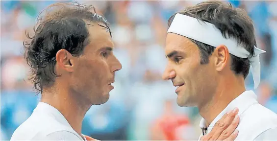  ?? AFP ?? Frente a frente. Nadal y Federer escribiero­n una página dorada más de una de las historias más apasionant­es del deporte mundial.