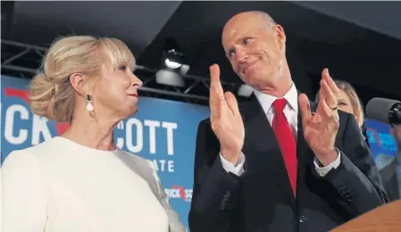  ?? GETTY IMAGES ?? BATTLE ON: Republican Senate candidate Gov. Rick Scott, above, shown yesterday with his wife, Ann, came out ahead of incumbent Democratic Sen. Bill Nelson, right, by a slim margin, putting the Florida race on the path toward a recount.