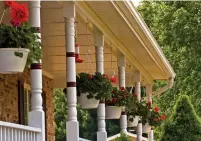  ?? DREAMSTIME PHOTOS ?? Plants are a no-fail addition to any porch. Consider hanging plants on the interior and potted plants beside the doorway.