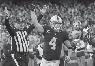  ?? MARCIO JOSE SANCHEZ/AP PHOTO ?? Raiders quarterbac­k Derek Carr (4) celebrates after throwing for a two-point conversion against the Panthers during an NFL game on Nov. 27, 2016 at Oakland, Calif.