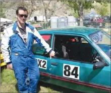  ?? ANDREA PEACOCK/The Okanagan Sunday ?? Dave Stephenson stands next to his car Saturday before racing up Knox Mountain during the 60th Hillclimb in Kelowna. Stephenson is competing in his fourth Hillclimb.