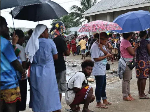 ?? Picture: Saeed Khan/ AFP via Getty Images ?? Voters queue up at a polling station to cast their vote during the General Election in Honiara, capital city of the Solomon Islands, yesterday, amid concerns ties with China will be deepened