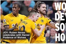  ?? ?? JoY: Ruben Neves celebrates with Daniel Podence of Wolves