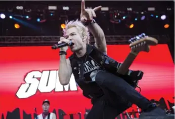  ?? JANOS MARJAI/THE CANADIAN PRESS FILE PHOTO ?? Seventeen years of hard living finally caught up with Deryck Whibley, landing the Sum 41 frontman in the hospital.