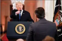  ?? The Associated Press ?? President Donald Trump speaks to CNN journalist Jim Acosta during a news conference Wednesday in the East Room of the White House in Washington.