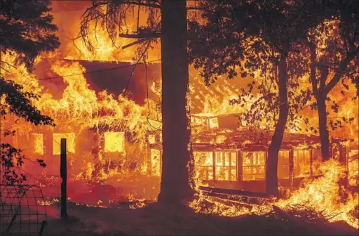  ?? THE DIXIE FIRE Noah Berger Associated Press ?? erupted in July 2021 after a tree fell on a small power line, destroying this home in Plumas County and hundreds of other structures.
