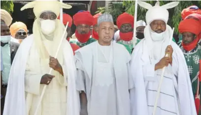  ??  ?? Governor Aminu Bello Masari of Katsina State, flanked by the
Emir of Kano,
Alhaji Aminu Ado Bayero, left and his brother, the Emir of Bichi, Alhaji Nasiru Ado Bayero when the Governor consoled with them over the death of their mother, at the Kano Emir’s palace yesterday.
