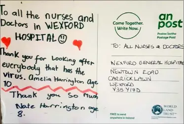  ??  ?? Signs have been erected at Wexford General Hospital in support of frontline workers and a lovely card received by hospital staff from Amerlia and Nate Harrington.